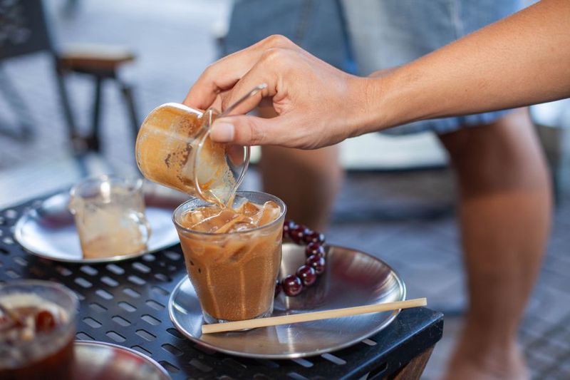 pouring coffee grounds tablespoon